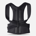 Crown Posture Corrector laid flat, showing the figure-eight shoulder straps and lumbar support panel