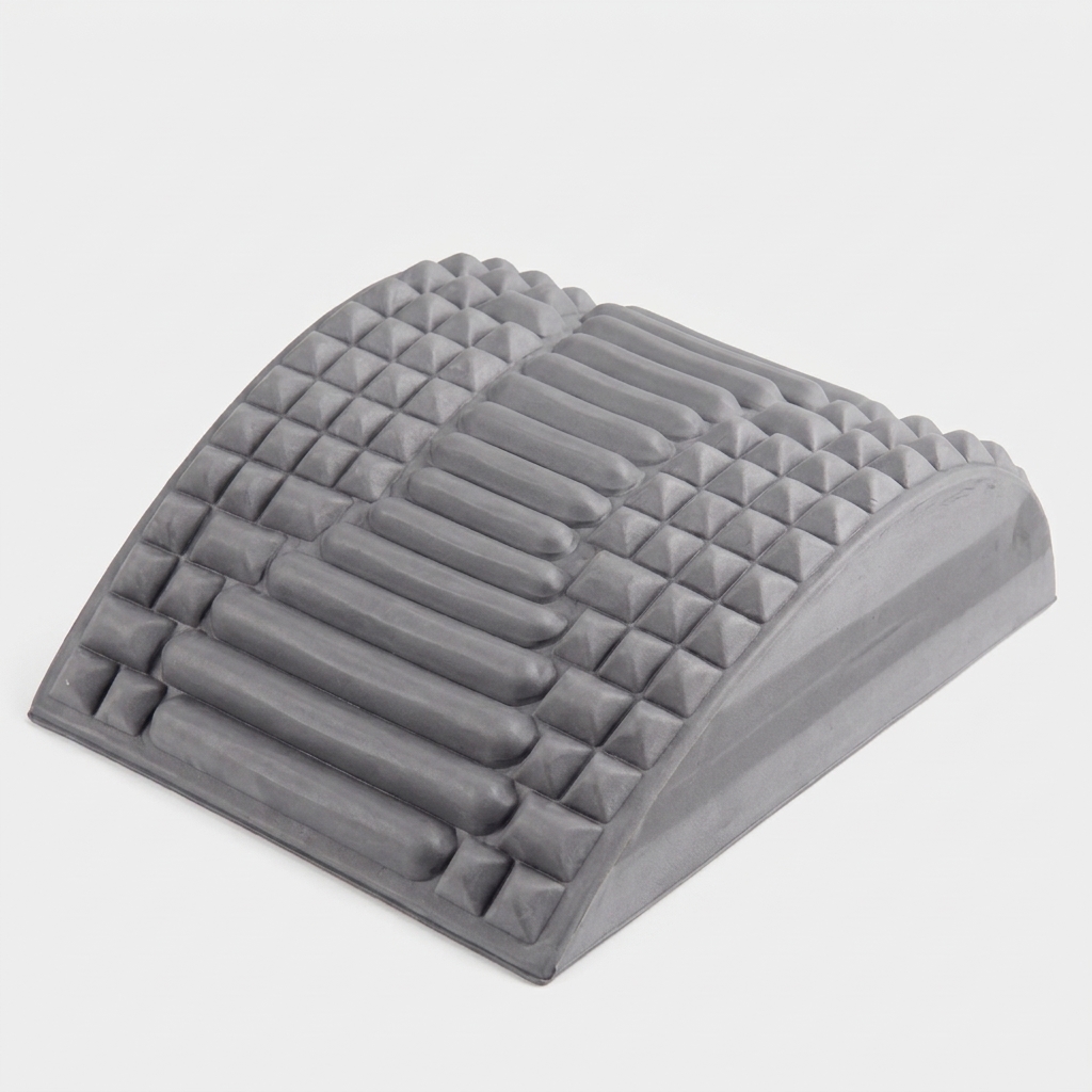 Crown Spinal Decompression Stretcher, a contoured grey arch with ridged and nubbed support surface