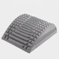 Crown Spinal Decompression Stretcher, a contoured grey arch with ridged and nubbed support surface